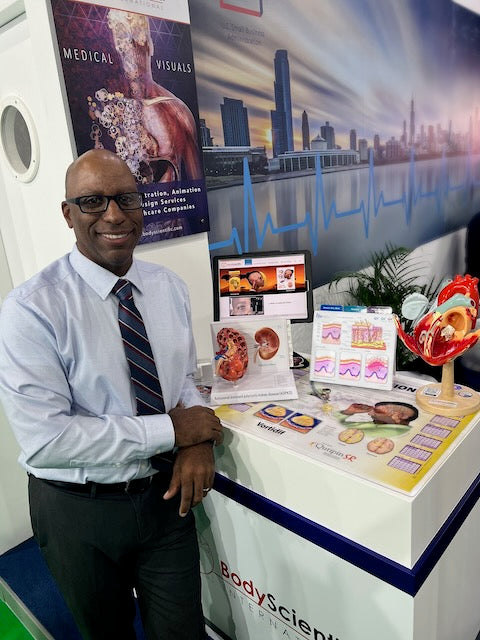 President Marcelo Oliver standing in front of product stand at tradeshow exhibition